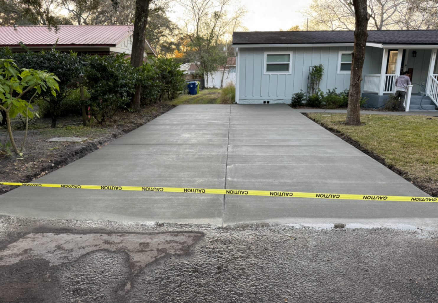 finisher cutting control joints into a fresh Columbus driveway with an early-entry saw